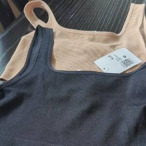 2 tops: One Black and One Beige Ribbed Crop Tops